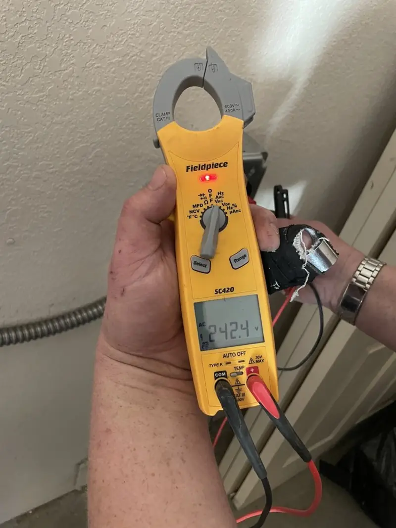 Voltage testing with clamp meter during Whole House Surge Protector in Chili